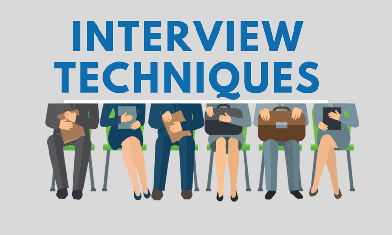 A group of people sitting in chairs with the words " interview techniques ".