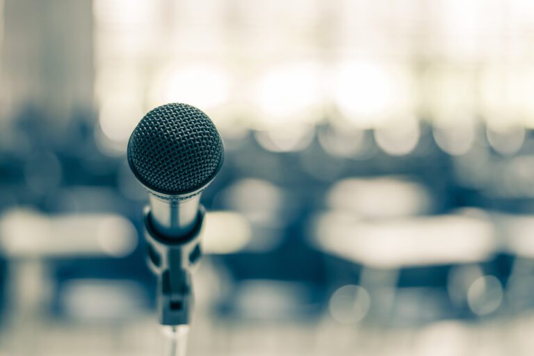 Closeup of a microphone on a stand.