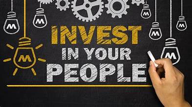 Chalkboard sign: Invest in your people.